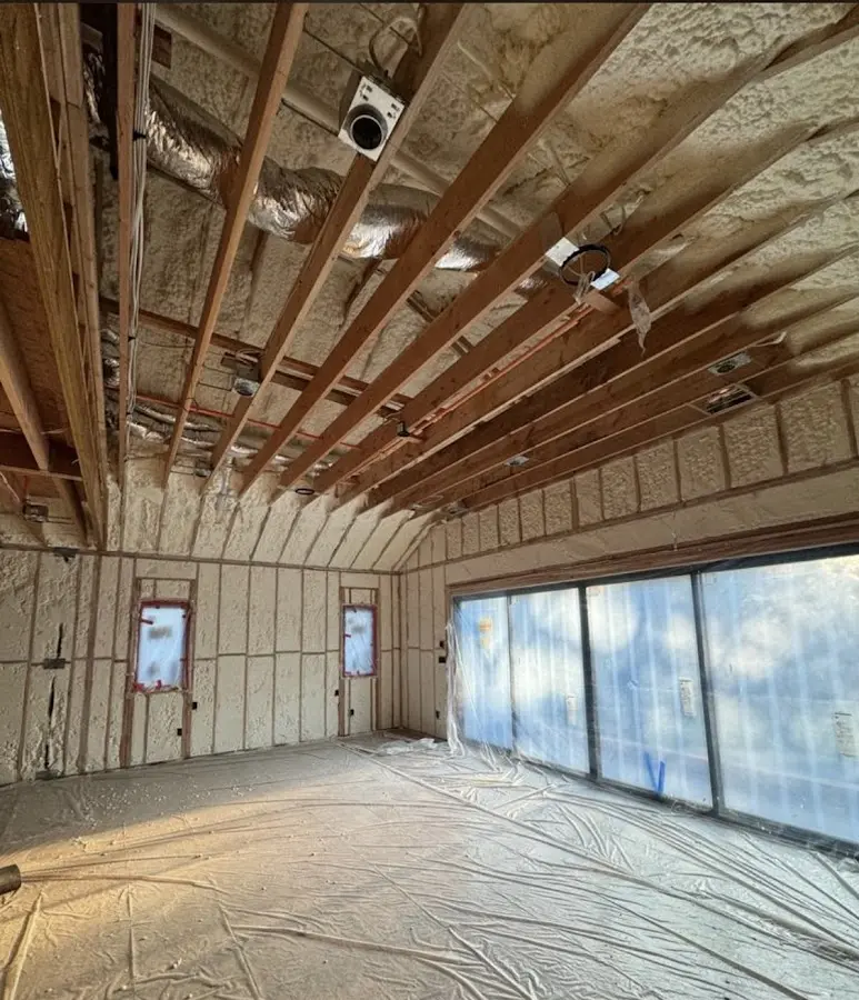 Interior walls and ceiling insulated with spray foam during new construction in Inverness Highlands South
